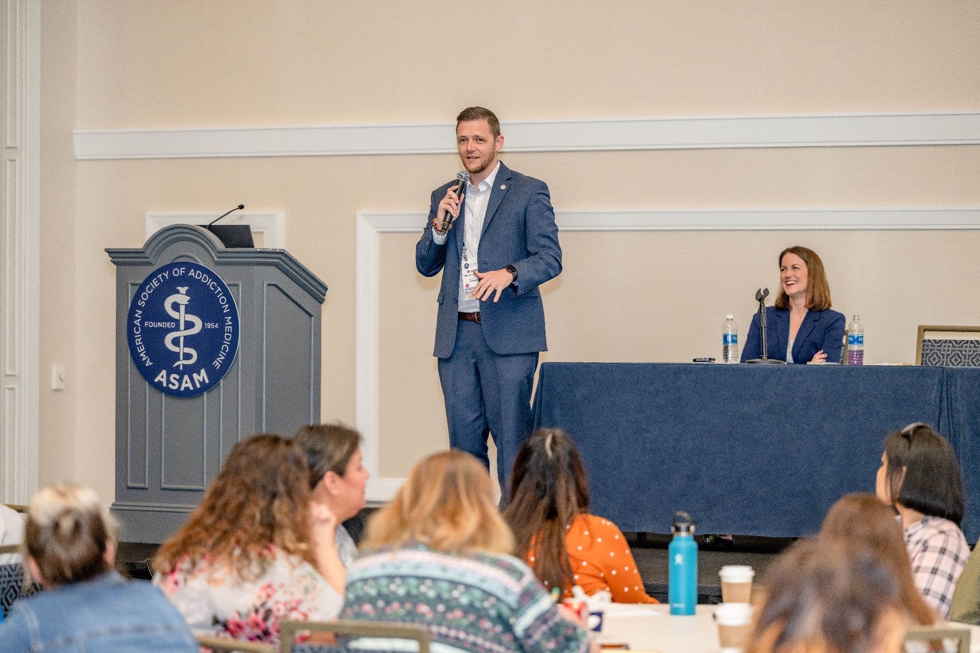 Brandon George speaking at the American Society of Addiction Medicine conference